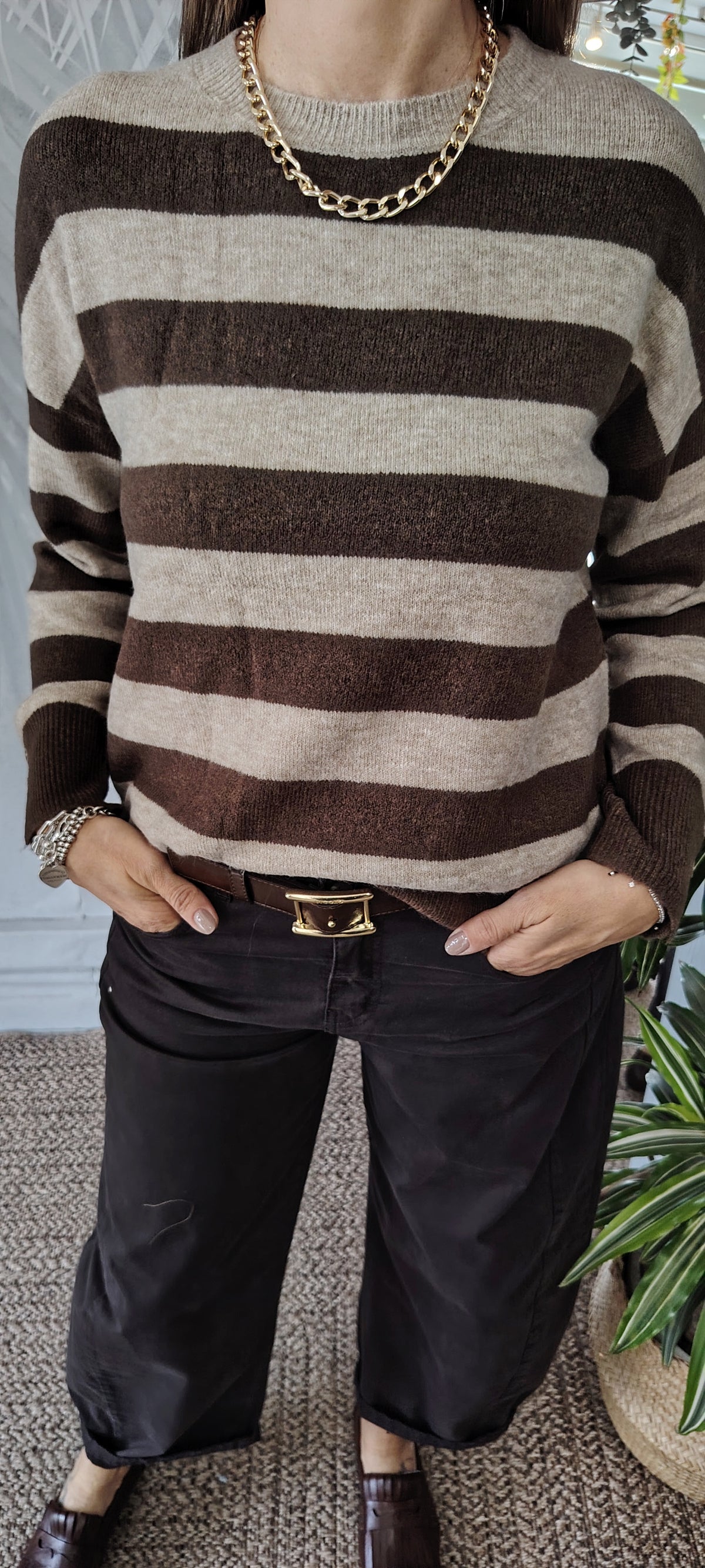 Pull righe bottoni polso