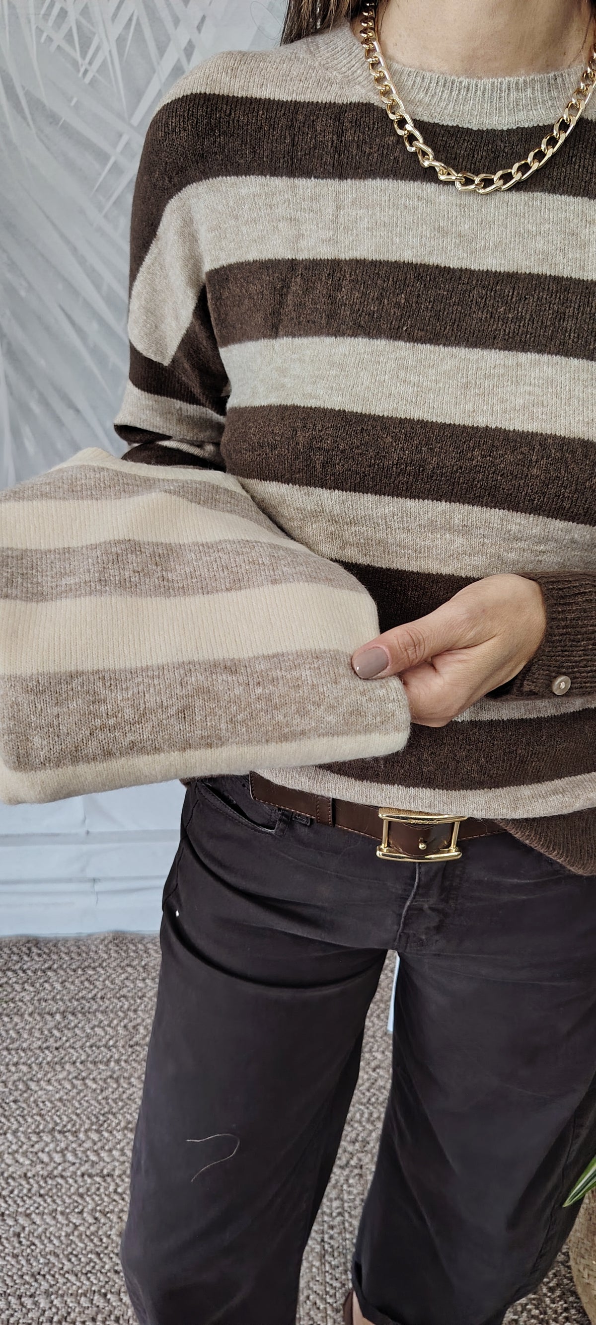 Pull righe bottoni polso
