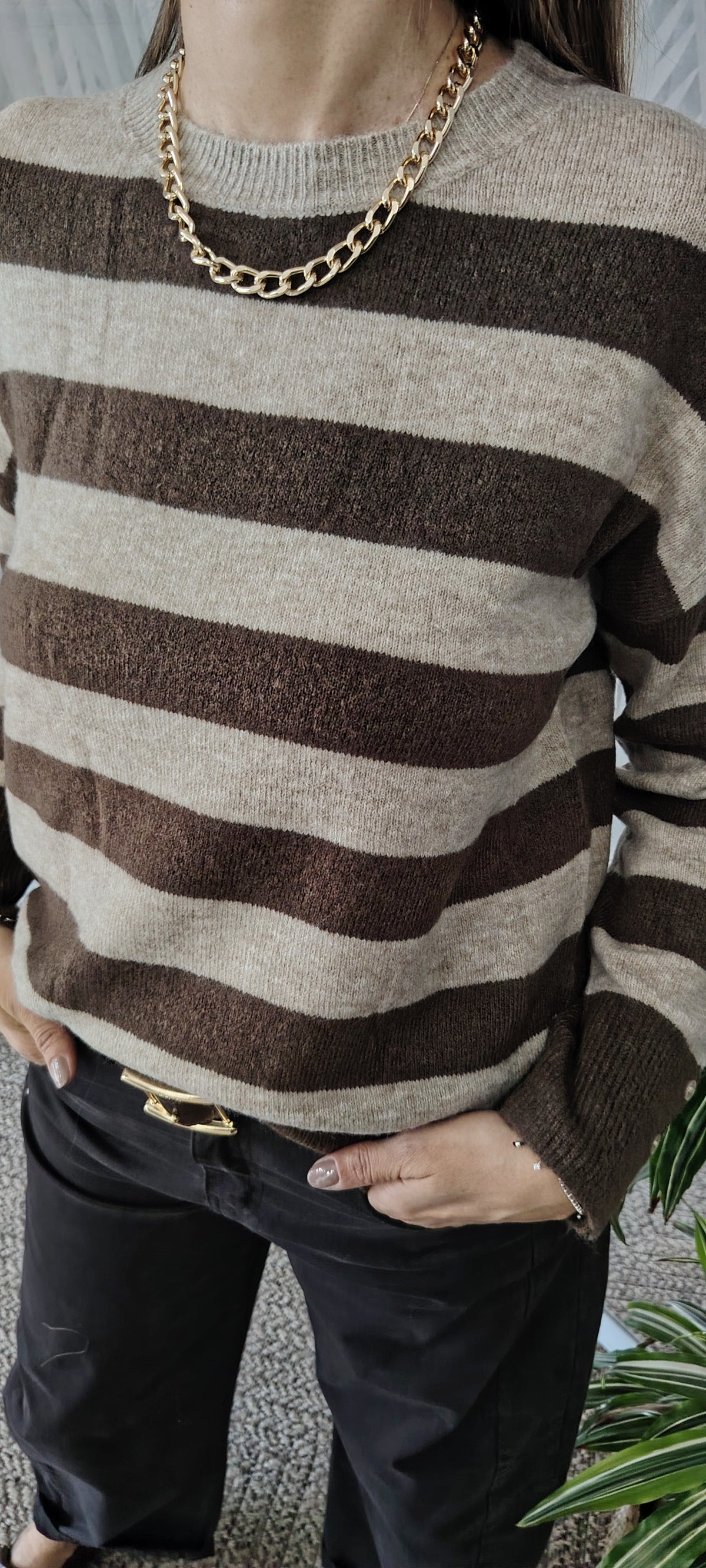 Pull righe bottoni polso
