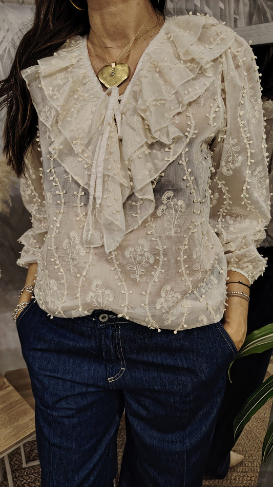 Blusa con rouches e motivi in rilievo